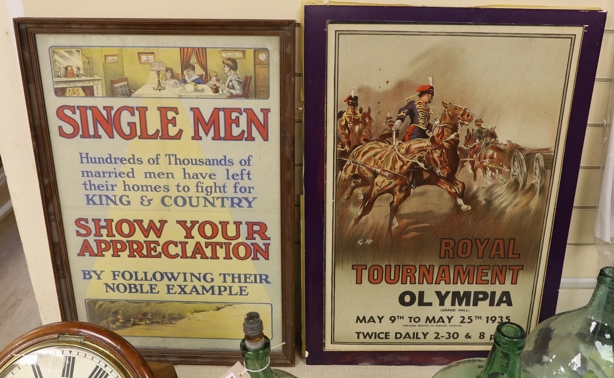 A WW1 framed poster ‘single men, hundreds of thousands of married men have left their homes to fight for King & Country’, together with another poster of the ‘royal tournament, Olympia’, dated 1935